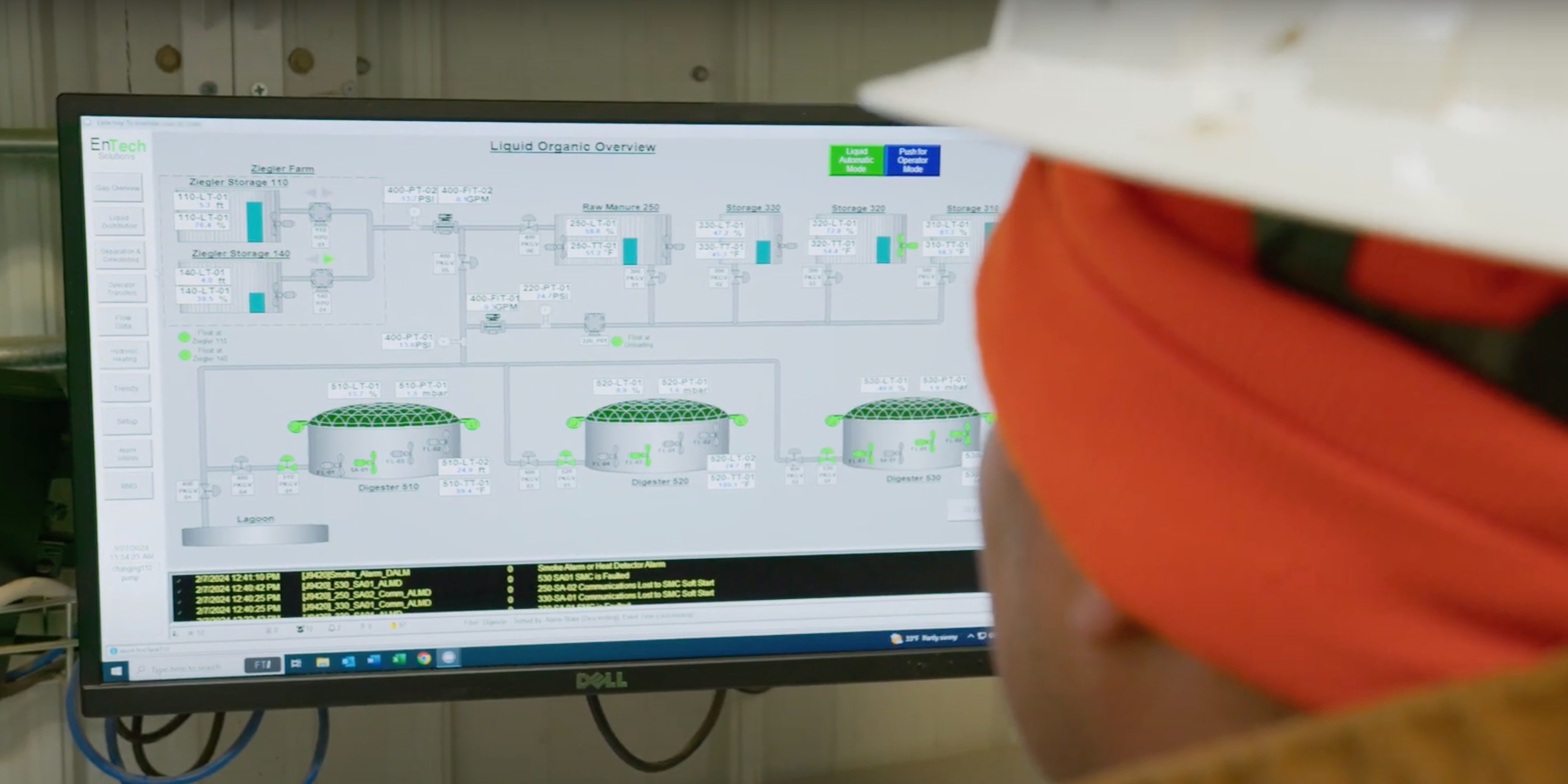 Biogas technician viewing Flygt mixer interface